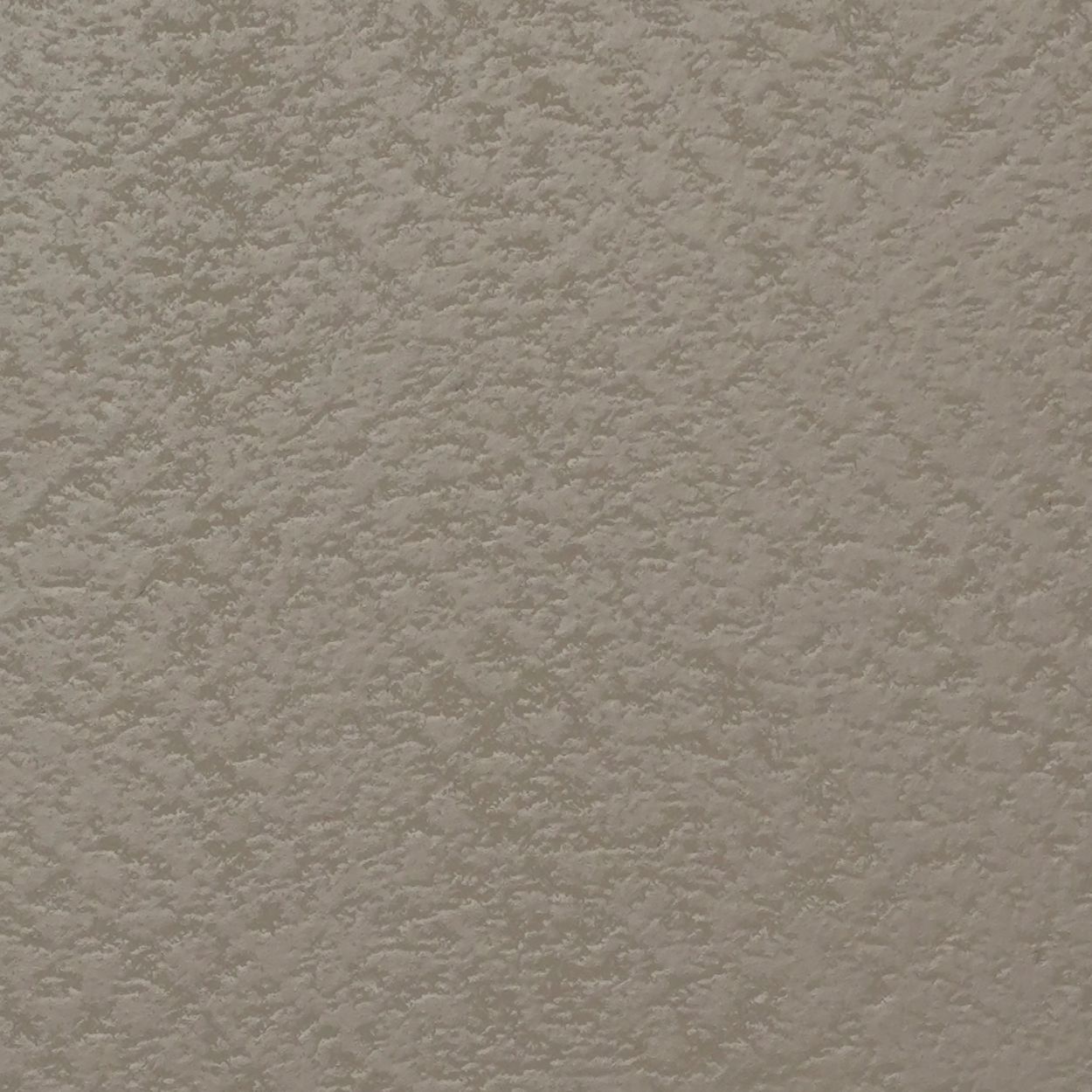 PL-128 stone grey laminate with pebble texture and soft matte finish by Plyneer.