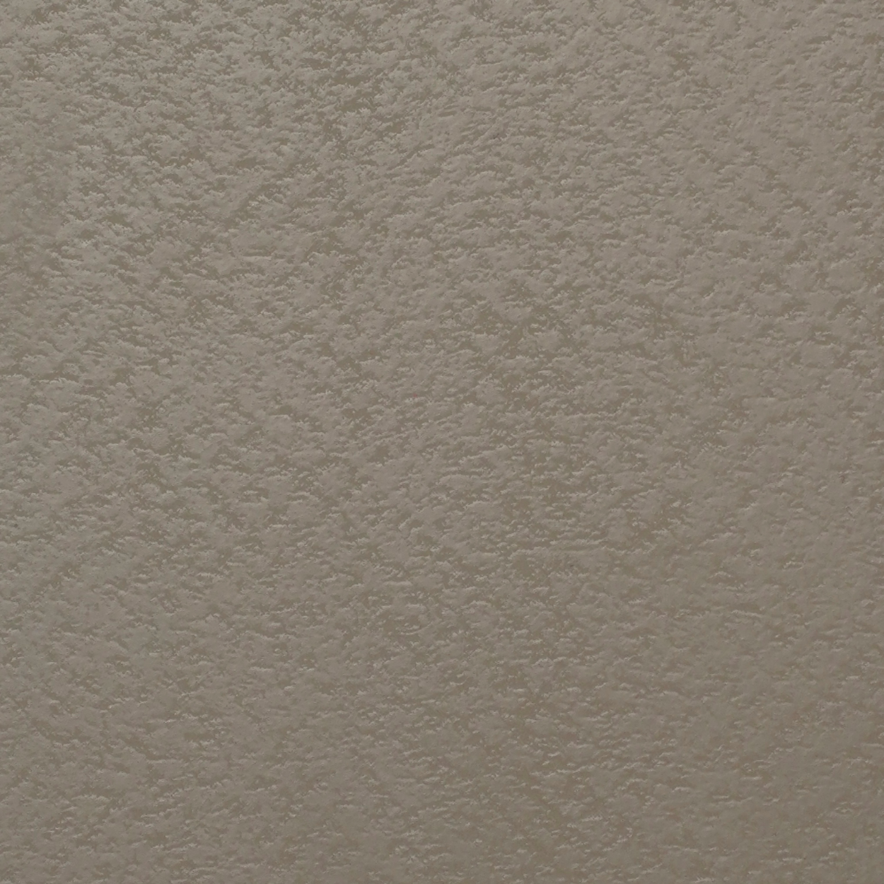 PL-130 ash grey laminate with pebble texture and matte finish by Plyneer.