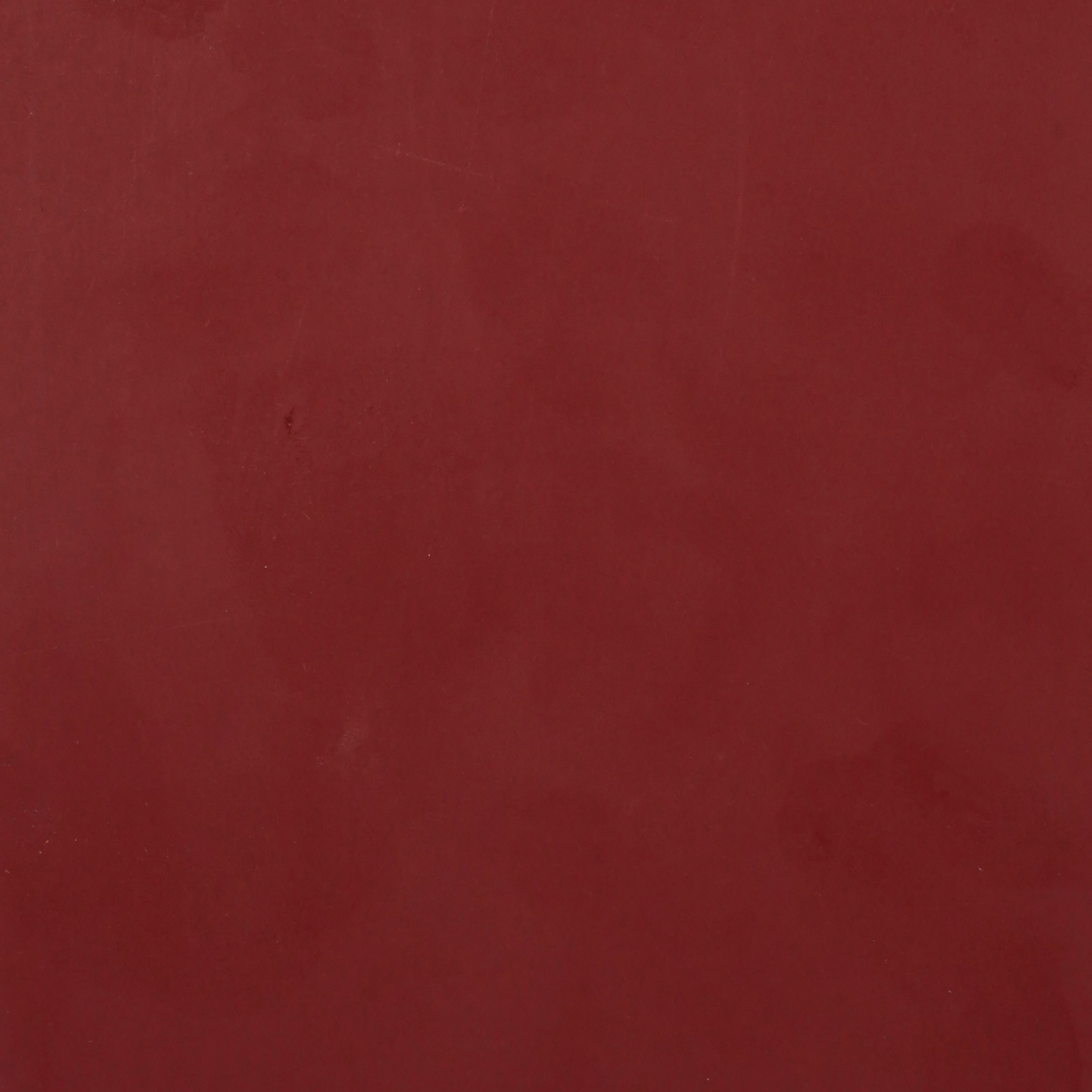 PL-207 Crimson Glow laminate with smooth red surface and glossy finish, perfect for bold and luxurious interiors by Plyneer.