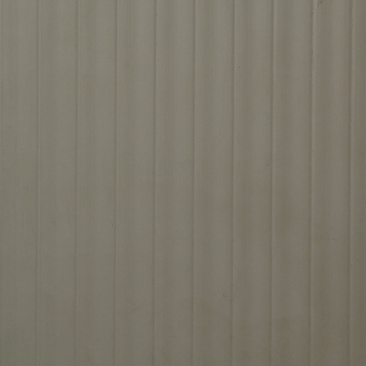 PL-115 ash grey laminate with vertical fluted groove texture and matte architectural finish by Plyneer.