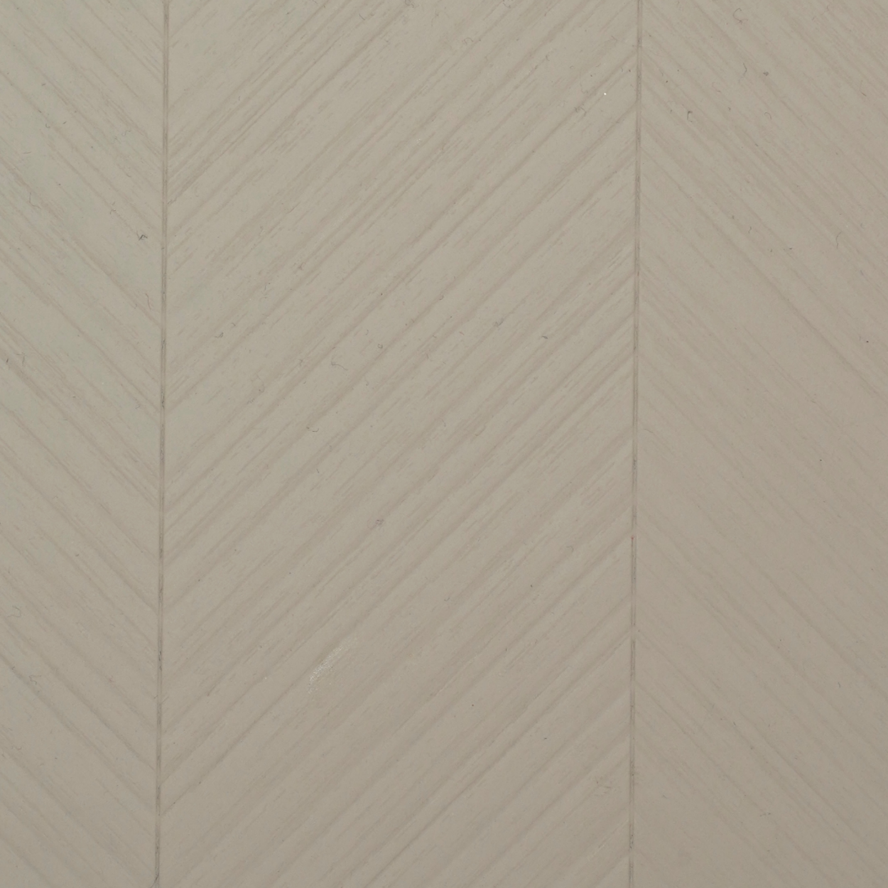 PL-116 mist grey laminate with chevron diagonal texture and matte finish by Plyneer.