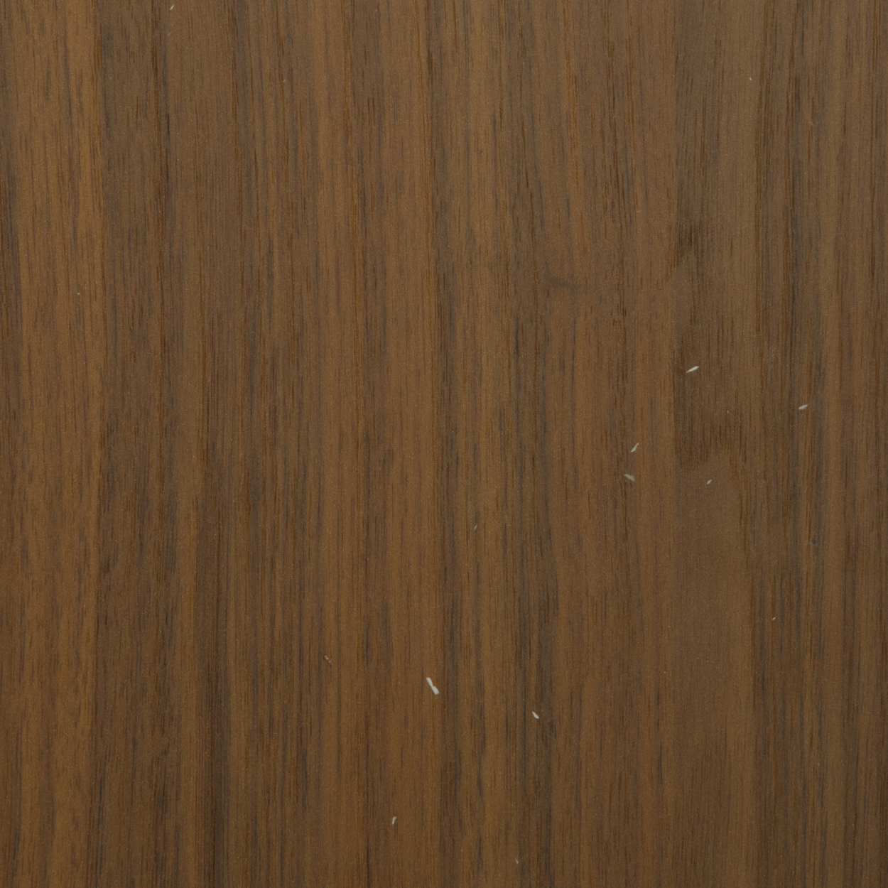 AS-546 walnut laminate with warm brown tone and vertical linear wood grains.